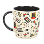 Mug with retro-themed design featuring cassette tapes, bicycles, and 'Game Over' signs on a white background.