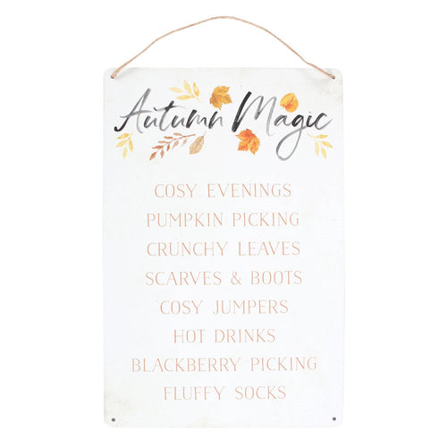 Decorative sign with 'Autumn Magic' text and fall-themed items on a white background