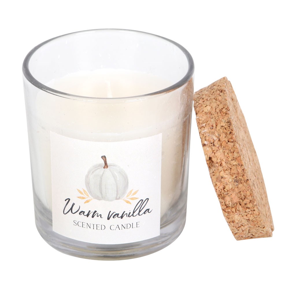Glass candle with a cork lid and 'Warm Vanilla' label on a white background