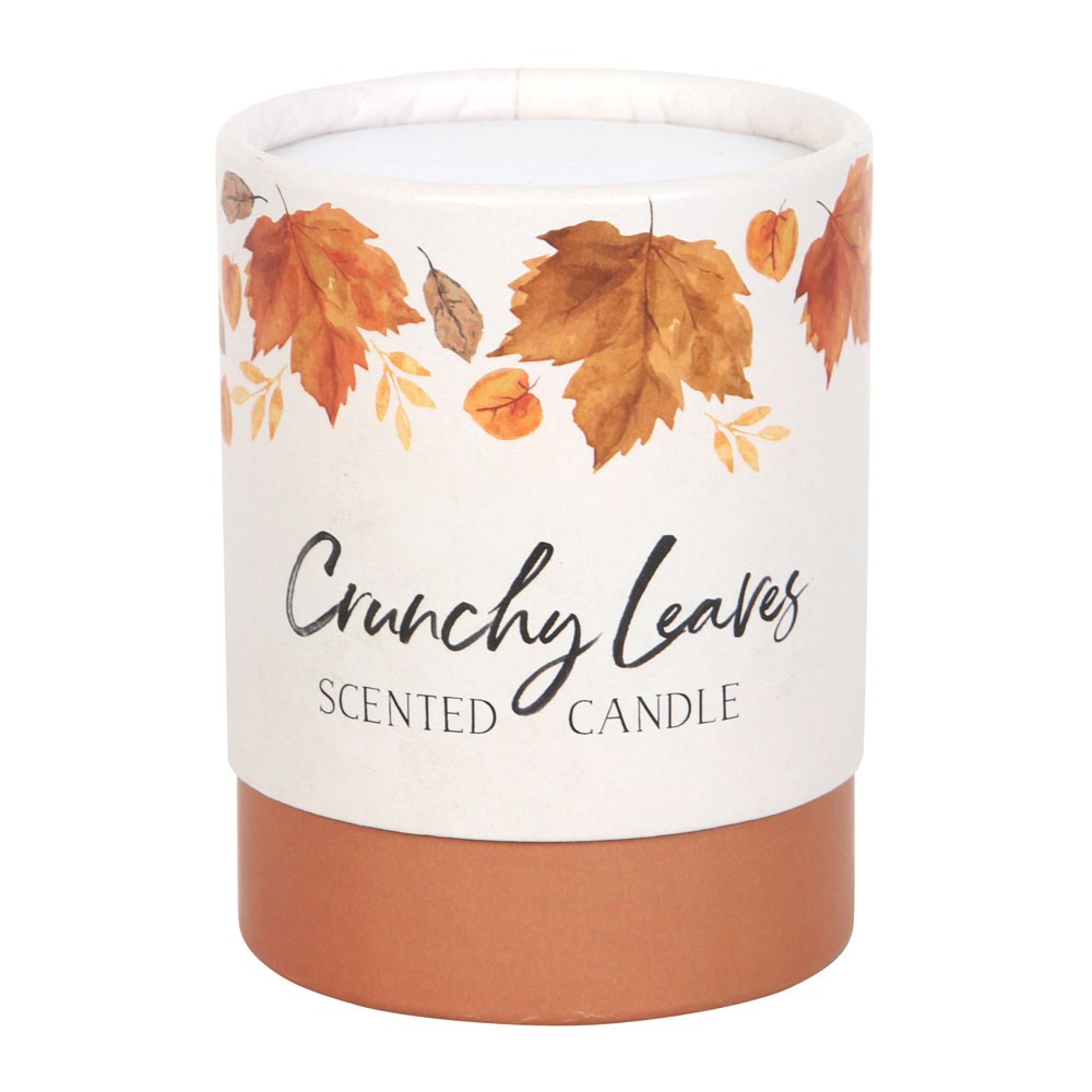 Scented candle with autumn leaf design on a white background