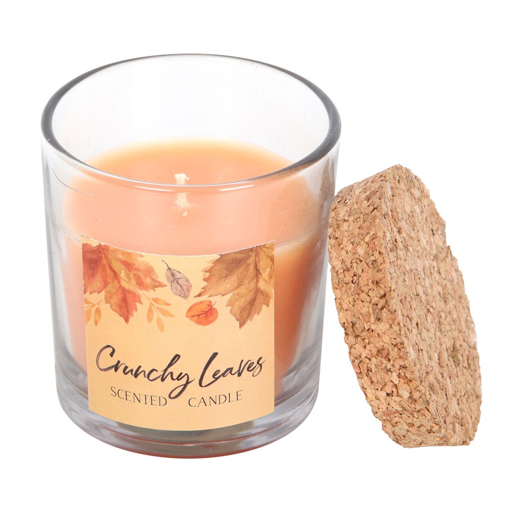 Scented candle labeled 'Crunchy Leaves' with a cork lid on a white background