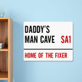 A personalised aluminium street sign style panel with black and red text, mounted on a wall.