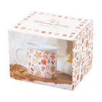 Ceramic mug with autumn leaf design in a decorative box