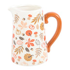White pitcher vase with orange handle featuring autumn-themed pattern on a white background