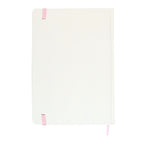 cream notebook with pink accents on a white background