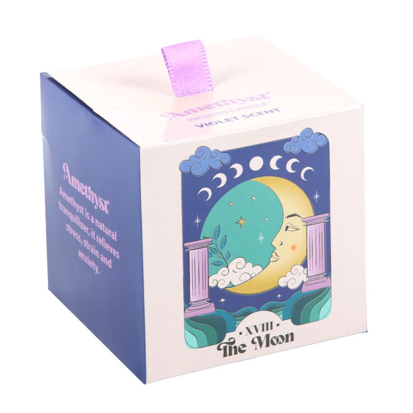 Decorative 'the moon' candle box with moon design and text on a white background