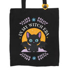 Black tote bag with a cat graphic and 'In My Witch Era' text on a white background