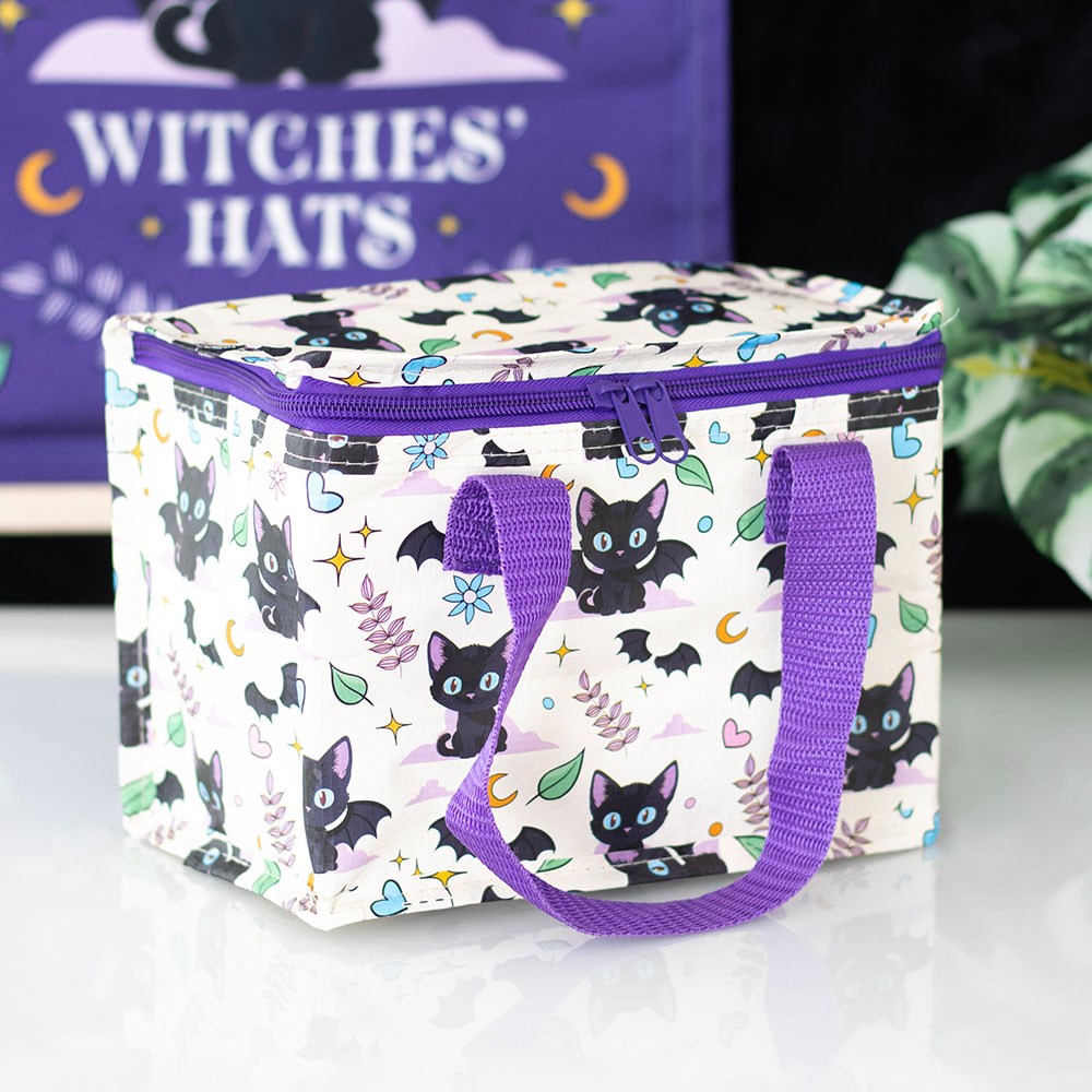  insulated lunch bag with black bat cat pattern and purple handles on a white surface