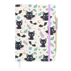 Notebook with black cat bat pattern on a white background
