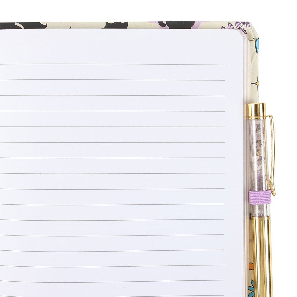 Notebook with bat cat design on the cover and a pen.