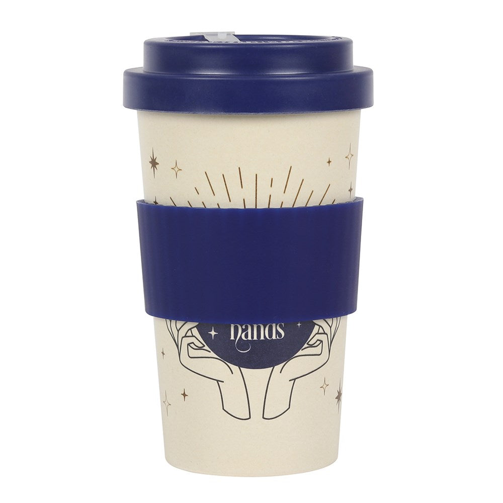 Travel mug with navy lid and sleeve on a white background