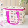  insulated lunch bag with butterfly and bug pattern and pink handles and zipper on a light background