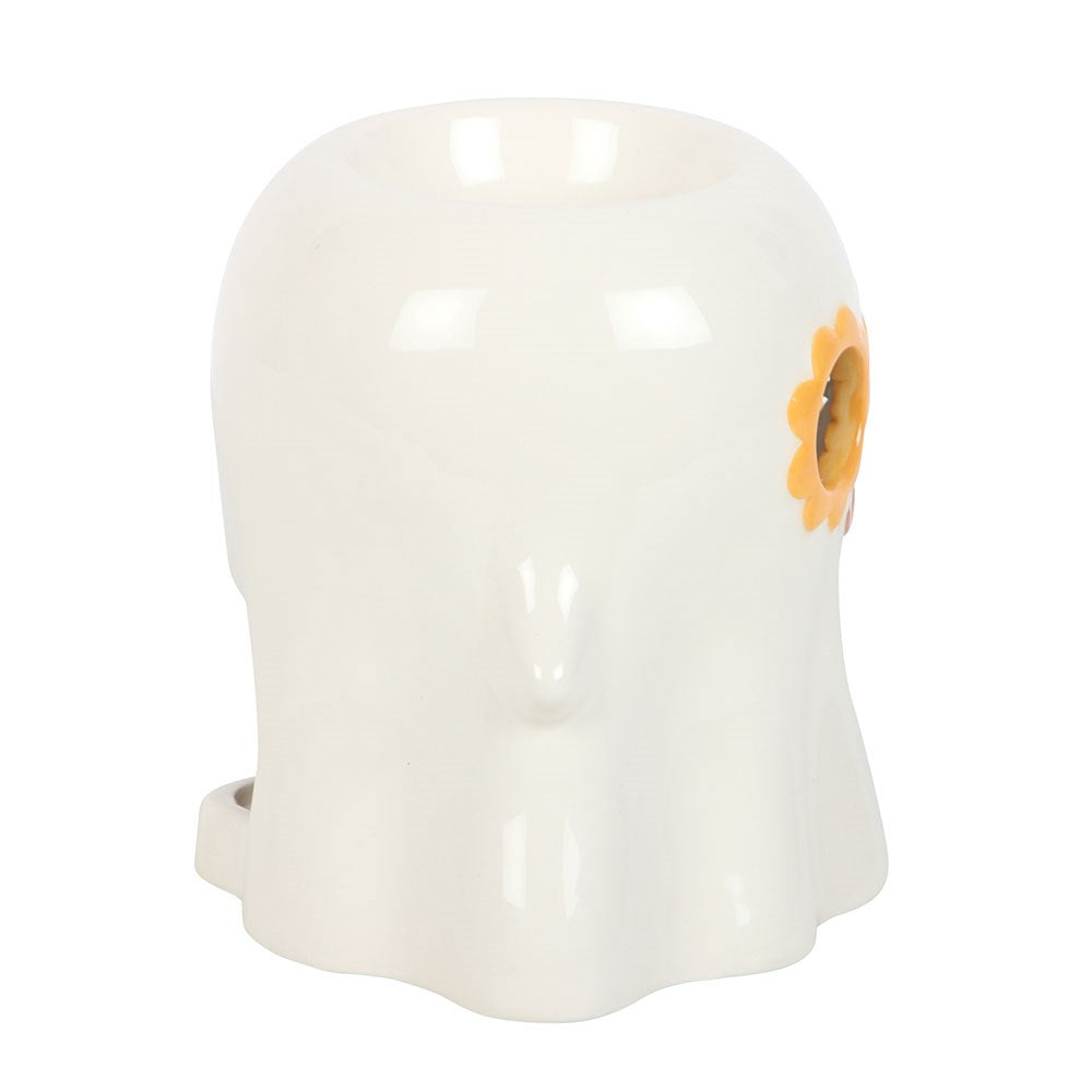 White ghost shaped oil burner with orange flower glasses feature on a white background