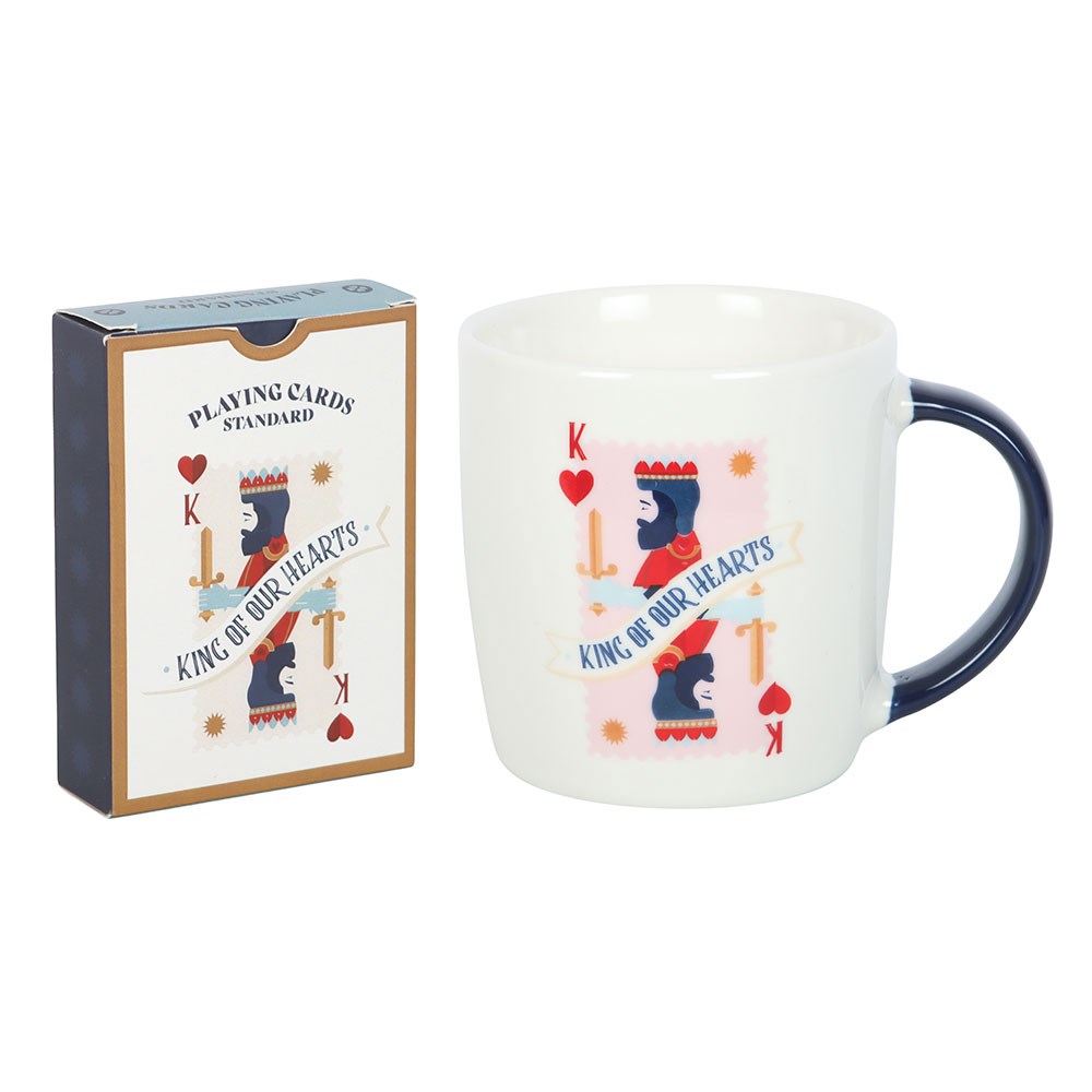 Mug with 'King of Our Hearts' design and playing card box on a white background
