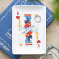 Playing card design  trinket plate with 'King of My Heart' text on a white card, placed on a blue mat.
