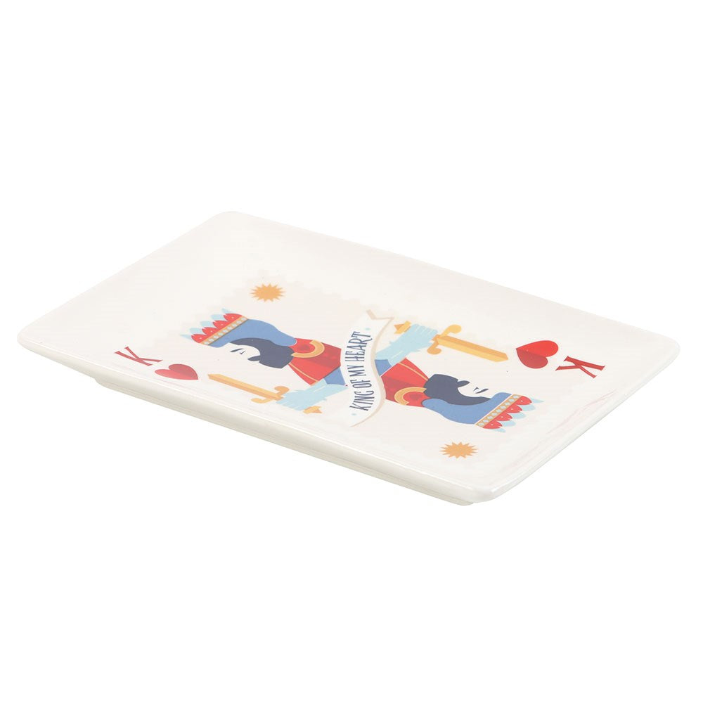 Rectangular white ceramic catch all plate with colourful king design on a white background