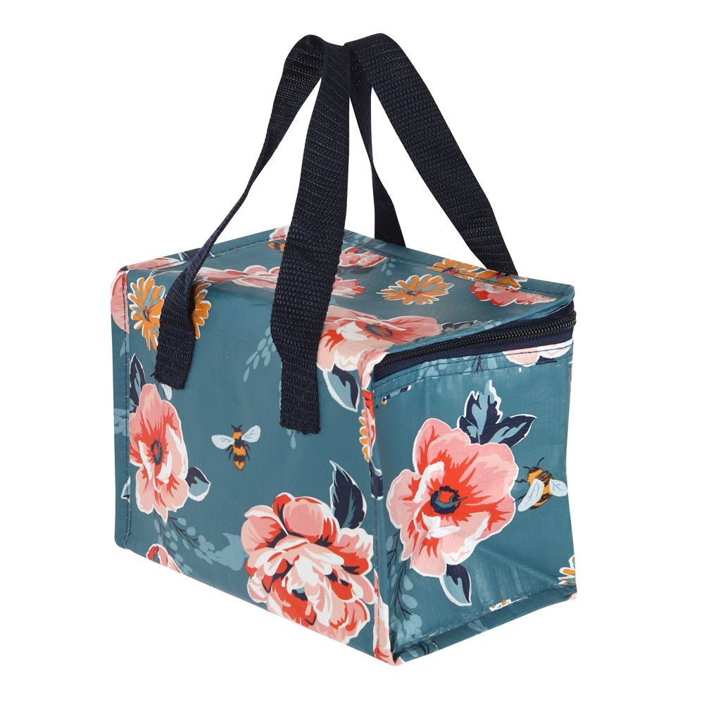 Floral and bee patterned cooler bag with navy handles on a white background