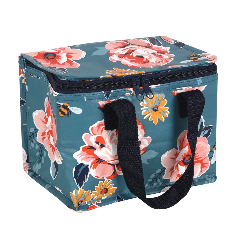Floral and bee patterned cooler bag with navy handles on a white background