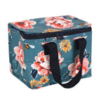 Floral and bee patterned cooler bag with navy handles on a white background