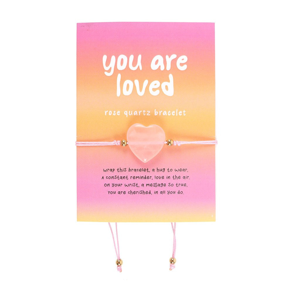 Rose quartz bracelet with 'you are loved' message on a pink and orange gradient card