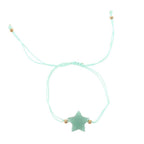 Bracelet with a star-shaped stone on a light blue cord against a white background