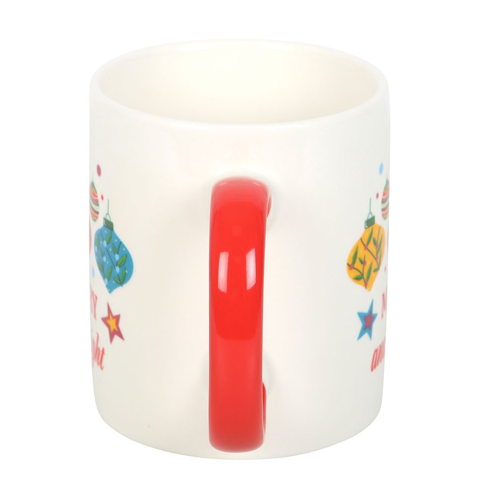 White mug with colorful designs on a white background