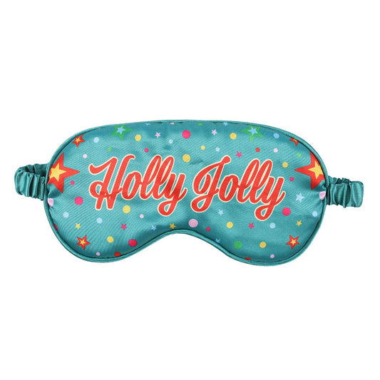 Sleep mask with 'Holly Jolly' text and festive pattern on a white background