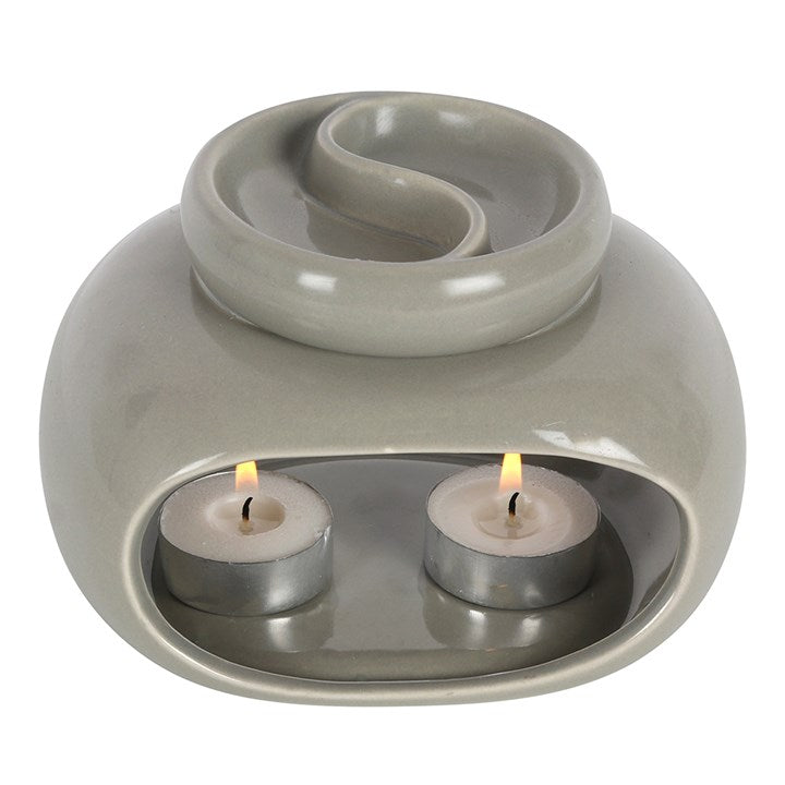close up of grey double oil burner showing candle location