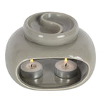 close up of grey double oil burner showing candle location