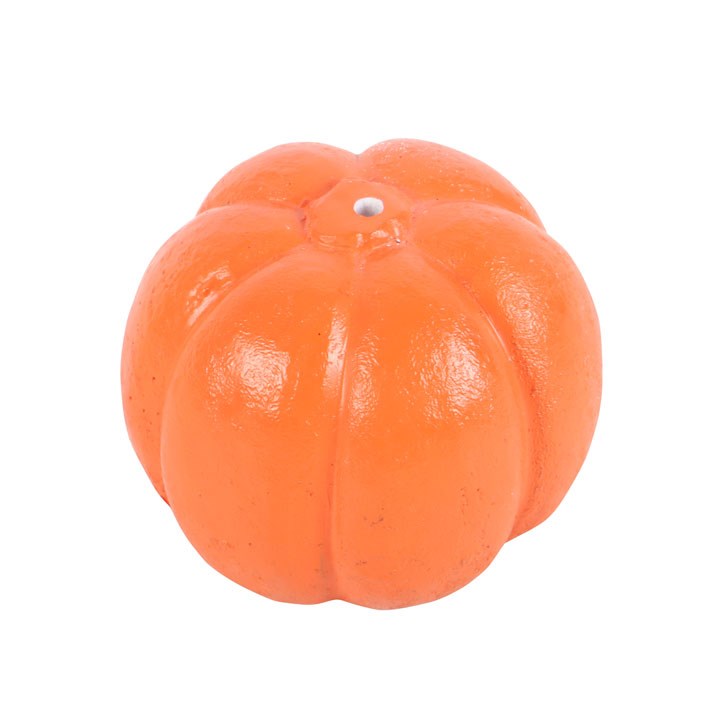 Orange pumpkin-shaped incense stick holder on a white background