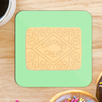 A square coaster with a custard cream design