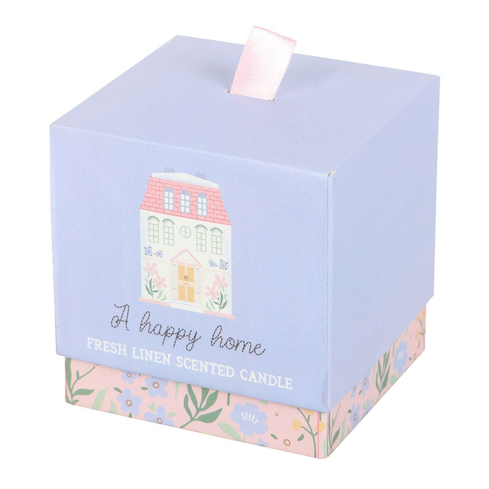 Candle box with a house illustration and 'A happy home' text on a white background