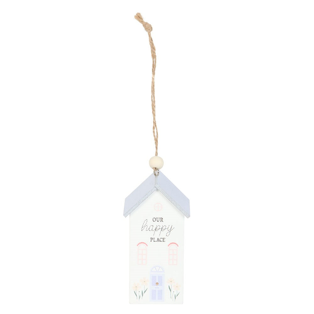 Decorative hanging object with 'Our happy place' text on a white background