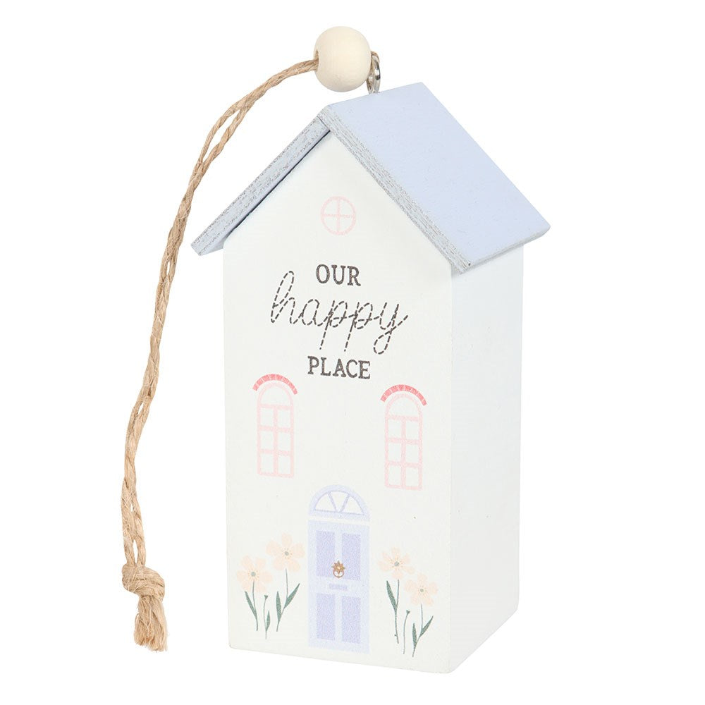 Decorative hanging house with 'Our happy place' text on a white background