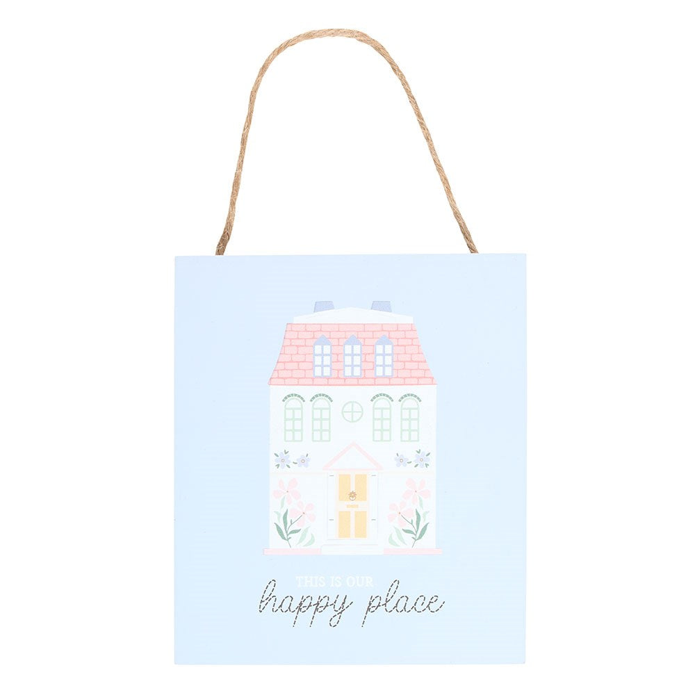 Decorative sign with a house illustration and 'this is our happy place' text on a lilac background.