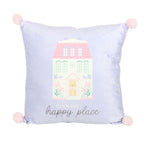Decorative lilac cushion with a house illustration and 'This is our happy place' text on a white background