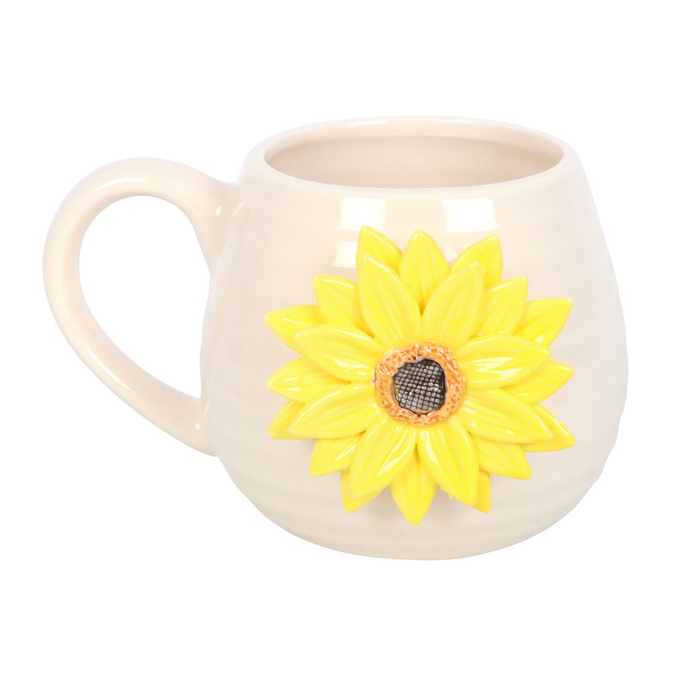 White mug with a yellow sunflower design on a white background