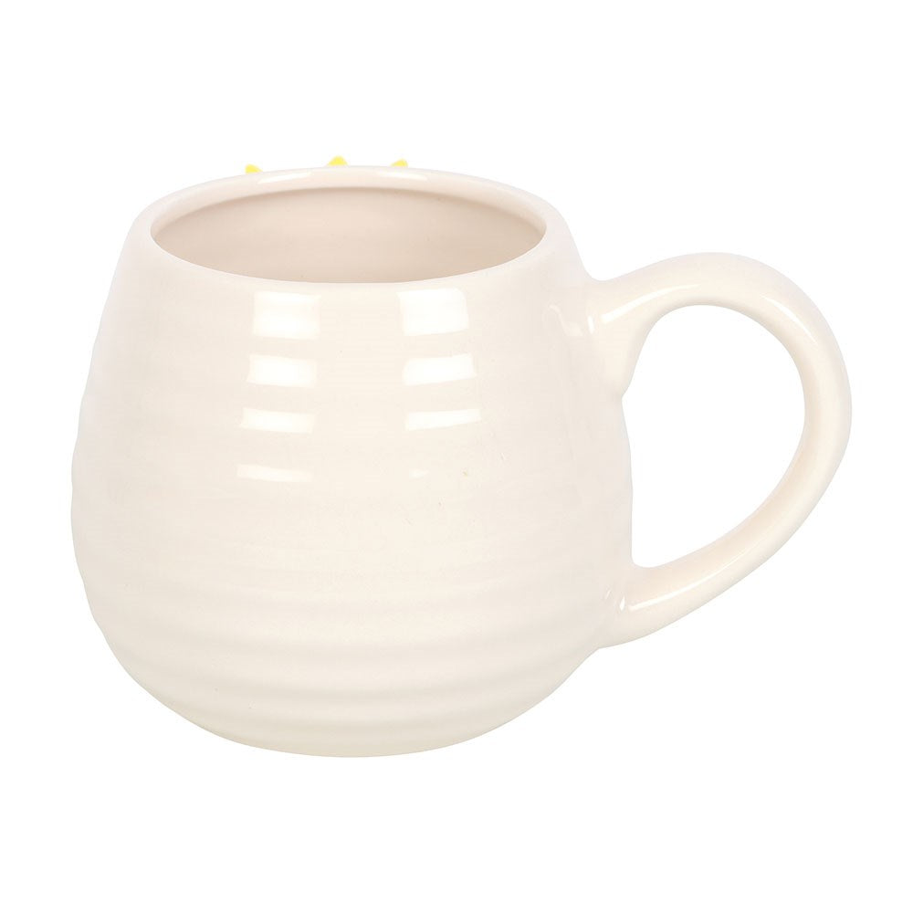 White ceramic ribbed mug on a white background