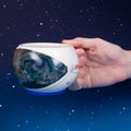 A ceramic mug with NASA heat change shape and embossed details