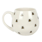 White mug with bee pattern on a white background
