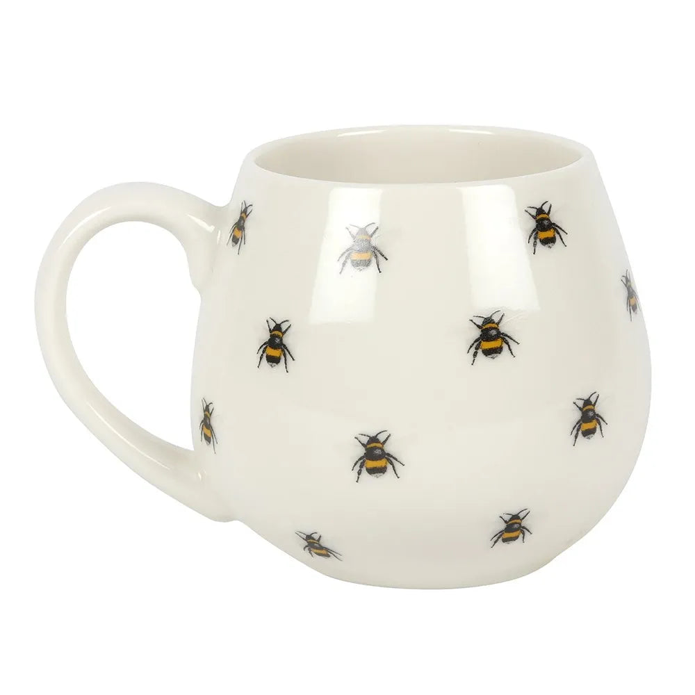 White mug with bee pattern on a white background