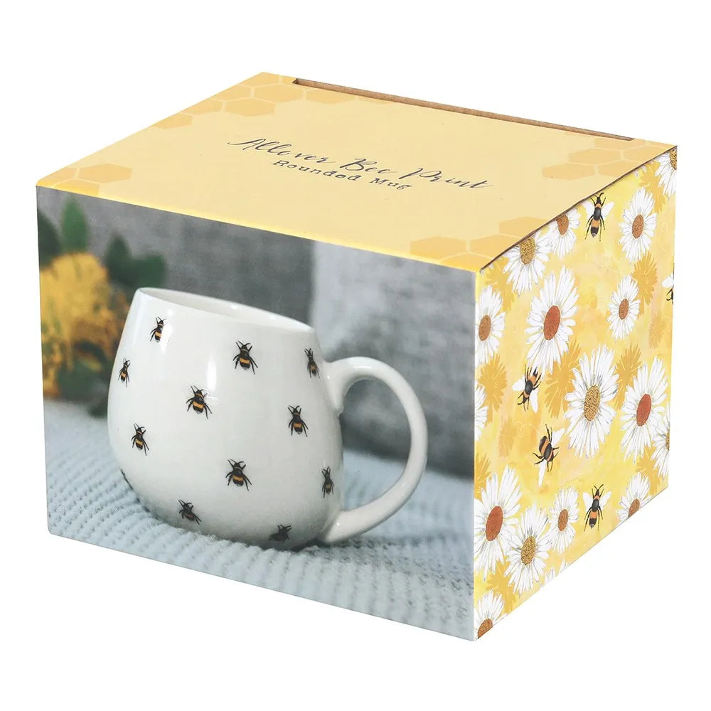 White mug with bee pattern in a decorative box with floral design
