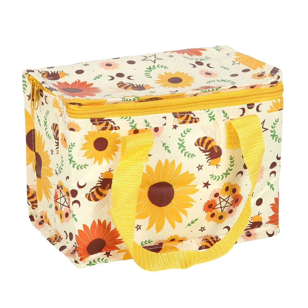 A rectangle-shaped insulated lunch bag with a cream-colored background and a vibrant sunflower and bee pattern. It features bright yellow handles and a yellow zipper, set against a plain white background.