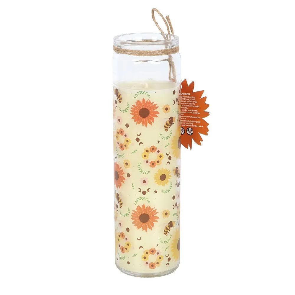 Glass tube candle with floral design and bees on a white background