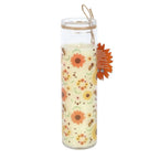 Glass tube candle with floral design and bees on a white background