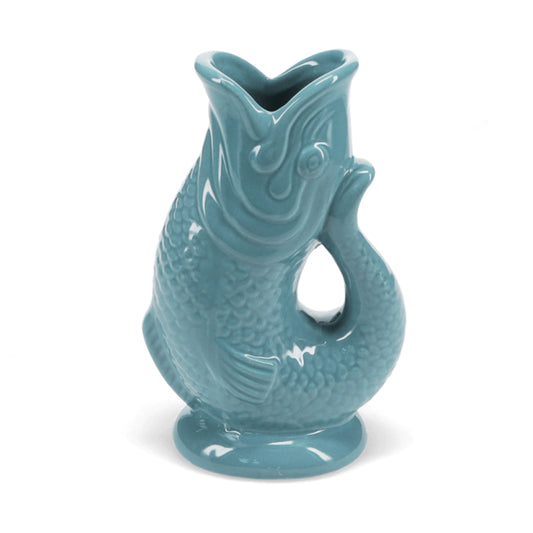 Teal ceramic fish-shaped vase on a white background