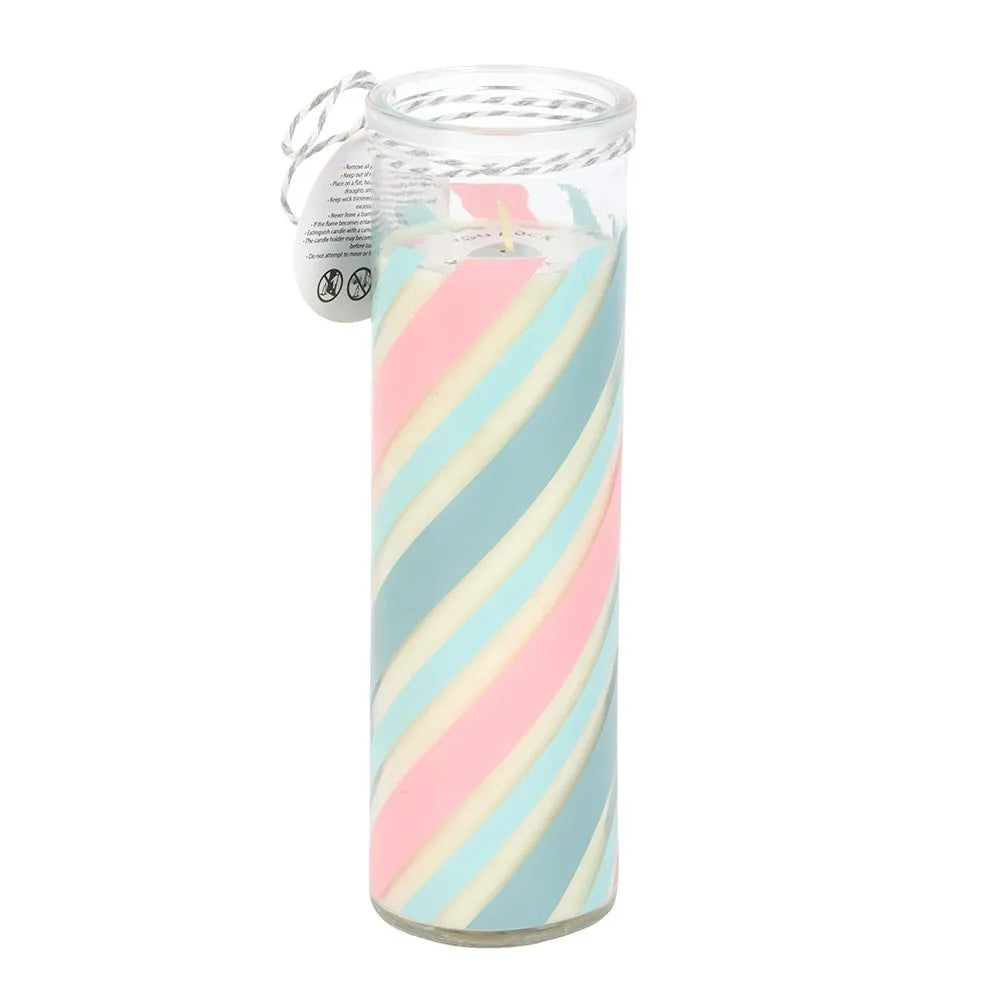 Tube candle with pastel pink and blue striped design on a white background