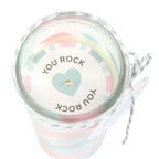 glass tube candle with a decorative lid featuring 'YOU ROCK' text and heart design on a white background.