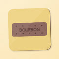 A square coaster featuring a bourbon biscuit on a yellow background