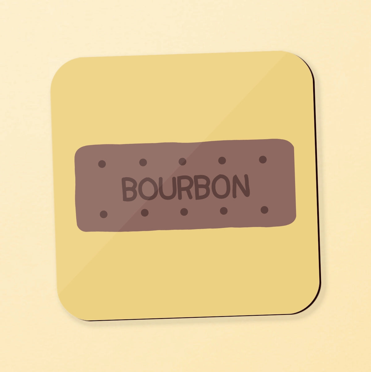 A square coaster featuring a bourbon biscuit on a yellow background
